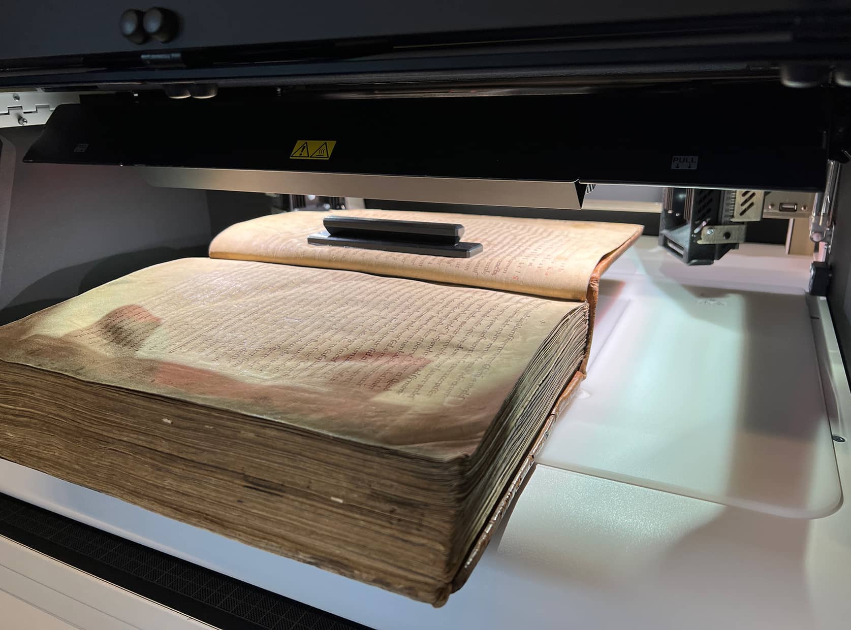 A book undergoes multispectral imaging analysis using a foster+freeman VSC 8000/HS workstation